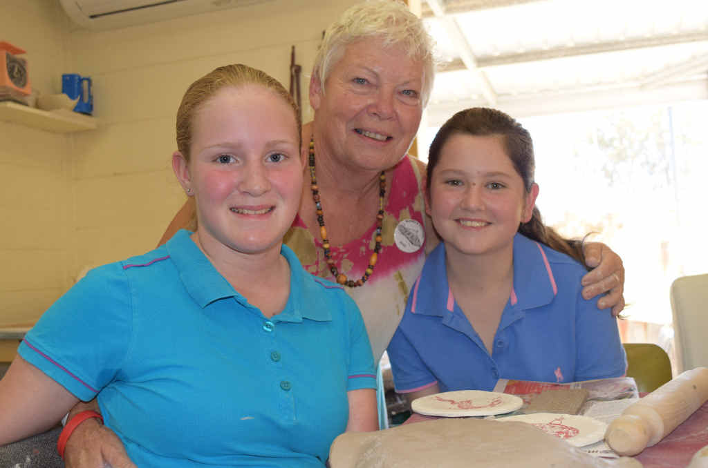 LITTLE POTTERS: Warwick Potters president with Jewel Schnitzerling and Kaitlyn Duggan at the kids’ workshops at the Warwick Potters on Saturday.